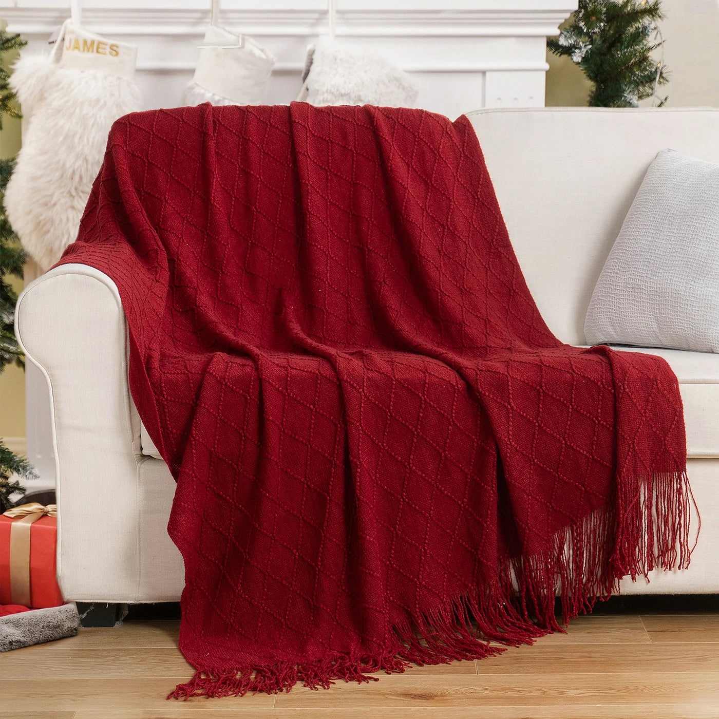 Battilo Plaid Knitted Throw Blanket Soft Woven Throws Sofa Blanket draped over a sofa arm.