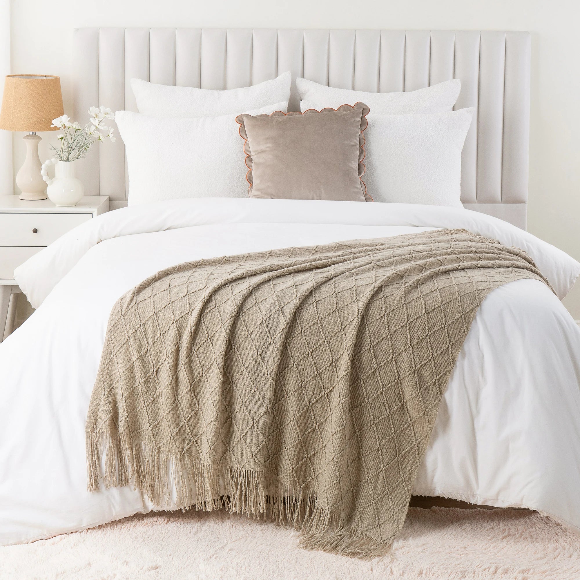 Battilo Plaid Knitted Throw Blanket Soft Woven Throws Sofa Blanket draped over a sofa arm.