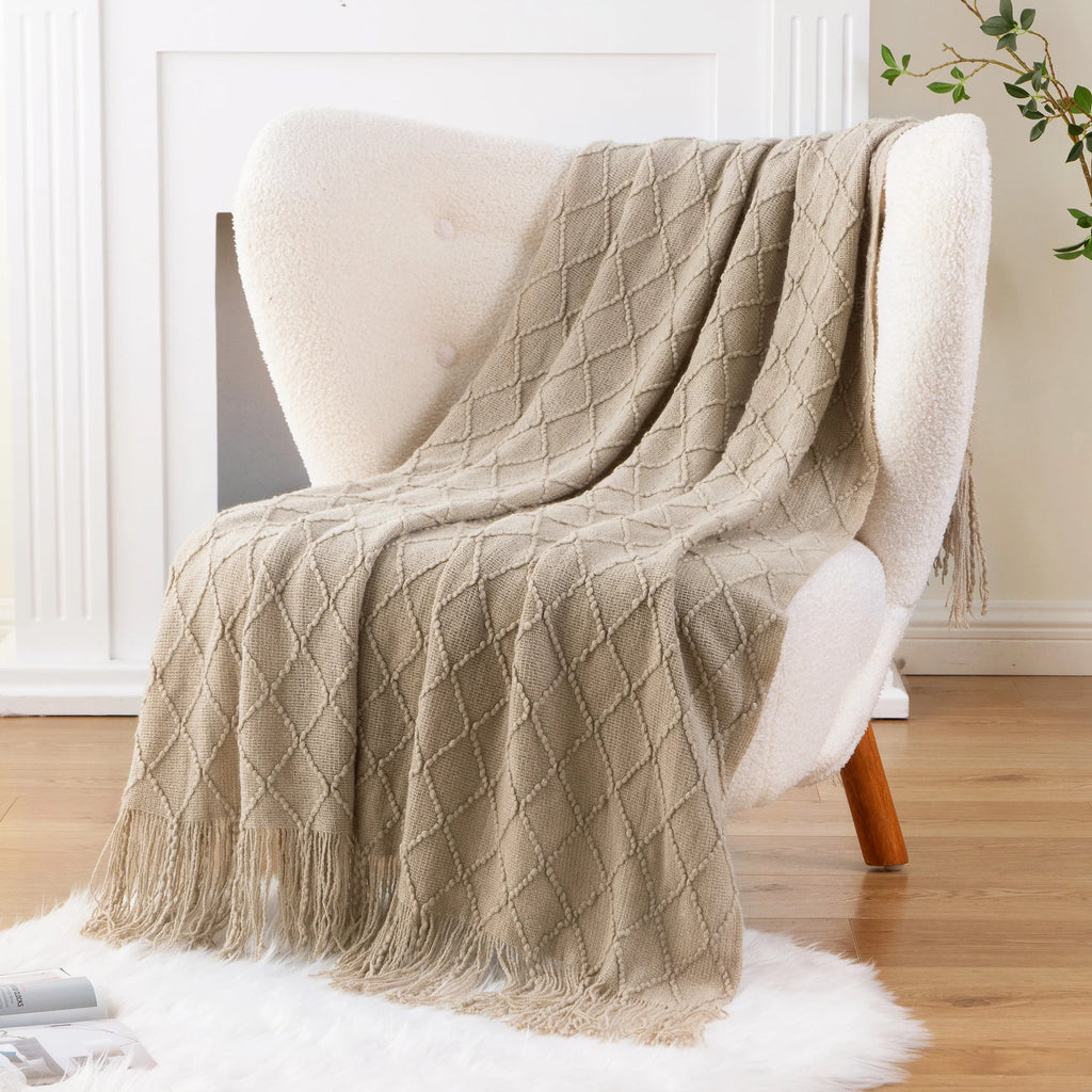 Battilo Plaid Knitted Throw Blanket Soft Woven Throws Sofa Blanket draped over a sofa arm.