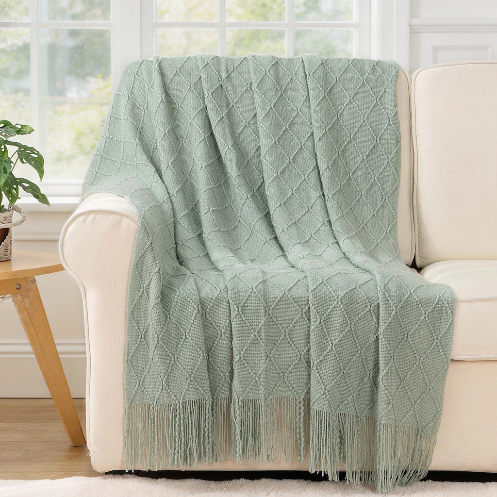 Battilo Plaid Knitted Throw Blanket Soft Woven Throws Sofa Blanket draped over a sofa arm.