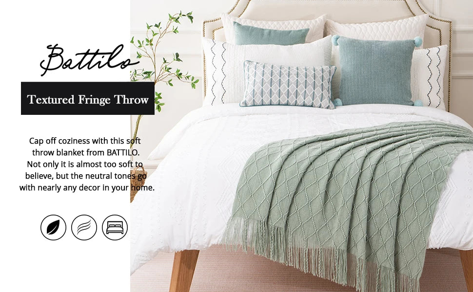 Battilo Plaid Knitted Throw Blanket Soft Woven Throws Sofa Blanket draped over a sofa arm.
