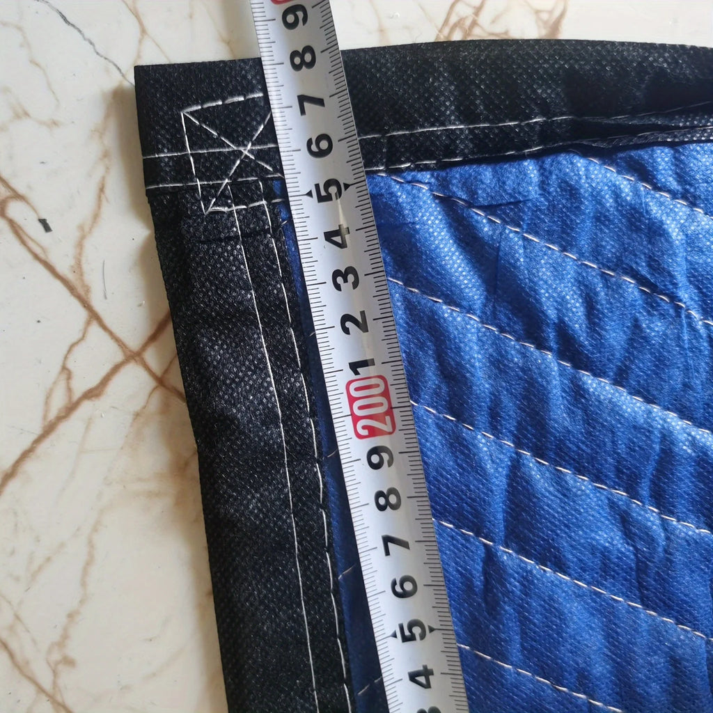 Mobile blanket-- heavy-duty packaging blanket folded, showcasing blue and black fabric textures.