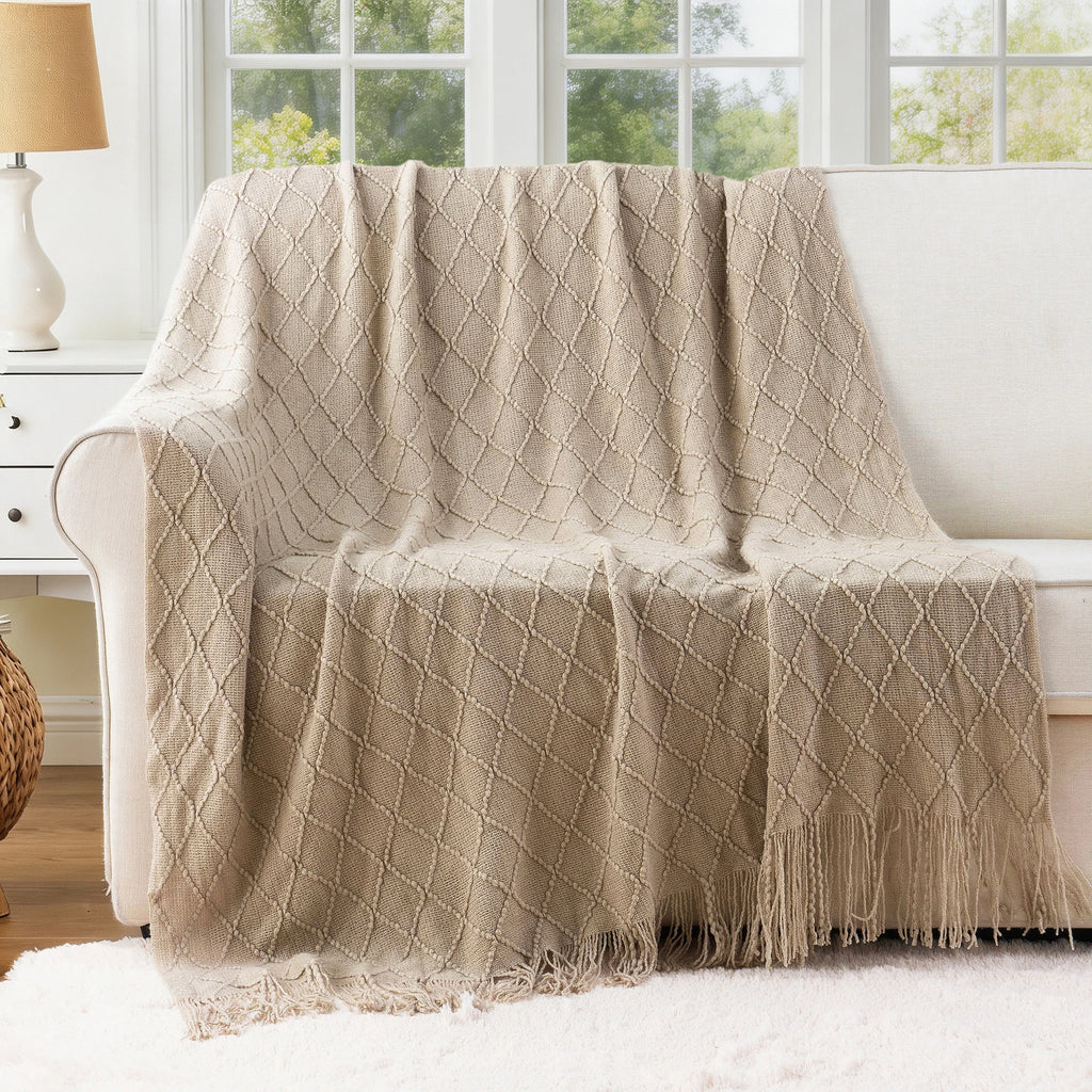 Battilo Plaid Knitted Throw Blanket Soft Woven Throws Sofa Blanket draped over a sofa arm.