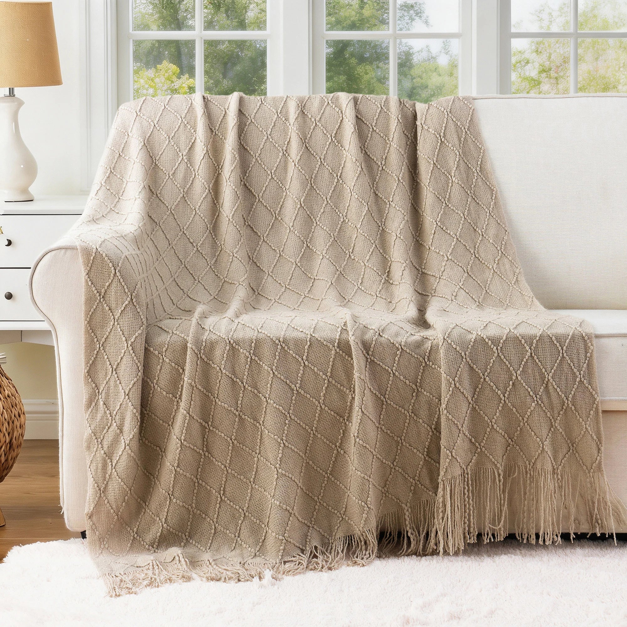 Battilo Plaid Knitted Throw Blanket Soft Woven Throws Sofa Blanket draped over a sofa arm.