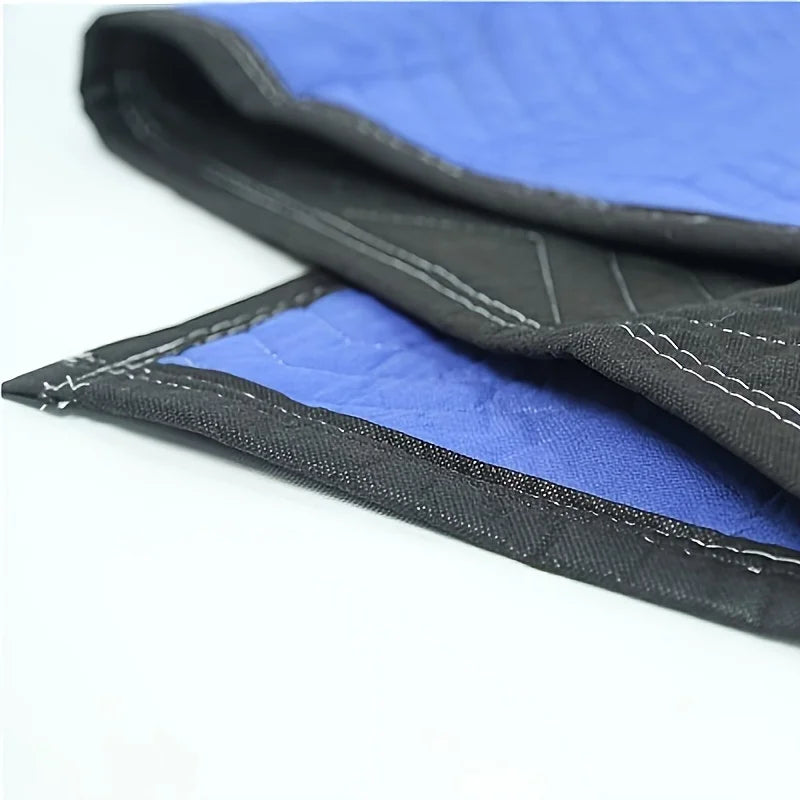 Mobile blanket-- heavy-duty packaging blanket folded, showcasing blue and black fabric textures.