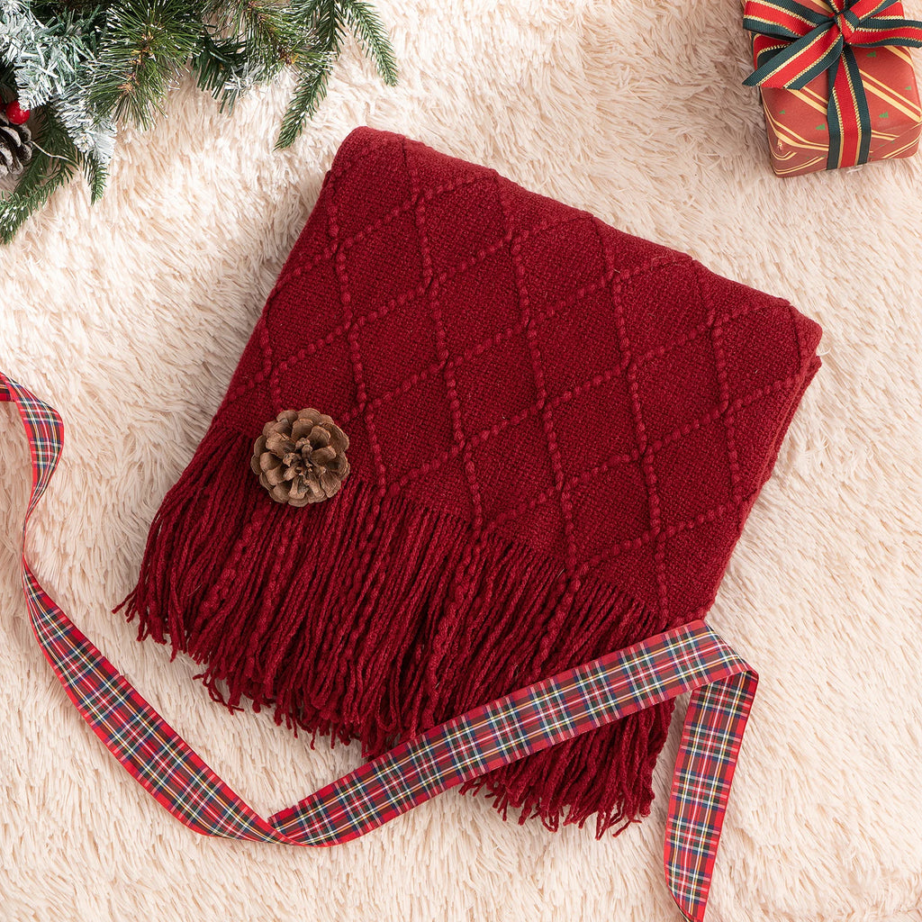 Battilo Plaid Knitted Throw Blanket Soft Woven Throws Sofa Blanket draped over a sofa arm.