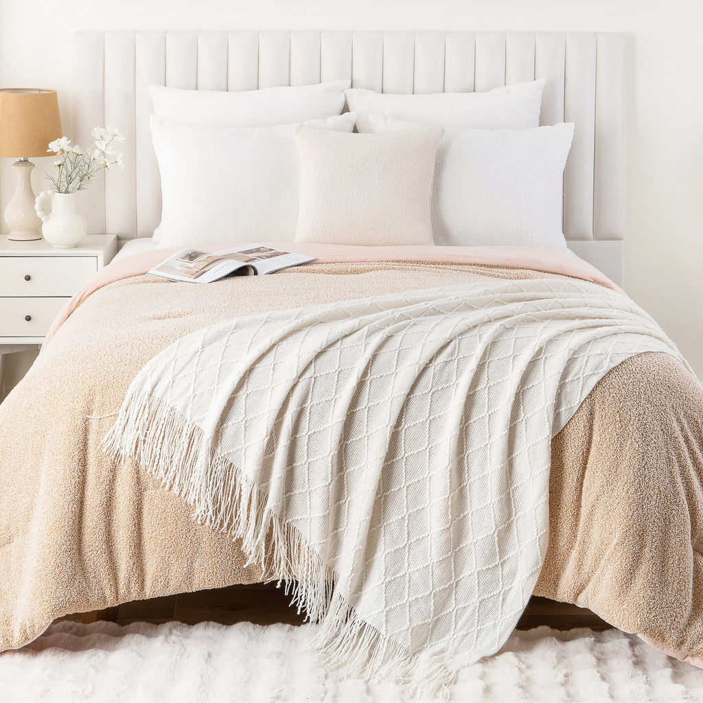 Battilo Plaid Knitted Throw Blanket Soft Woven Throws Sofa Blanket draped over a sofa arm.